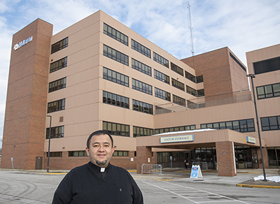 Father José María Cabrera, pastor of All Saints Parish in Bay City, has ministered to COVID-19 patients since March. As the youngest priest in the Bay City area, he administers the sacrament of the anointing of the sick at McLaren Bay Region Hospital.