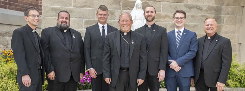 Fr. Andy LaFramboise, Deacon Daniel Christe, Carter Filhart, Bishop Robert Gruss, Charles Warner, Michael Kuehne, Fr. Bill Rutkowski