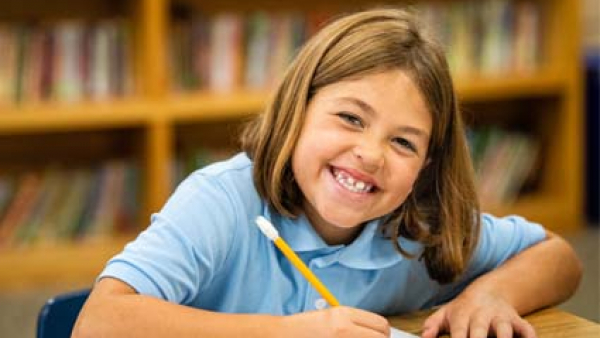 Catholic school girl writing