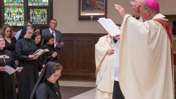 Bishop Gruss Blessing Sr. Graves