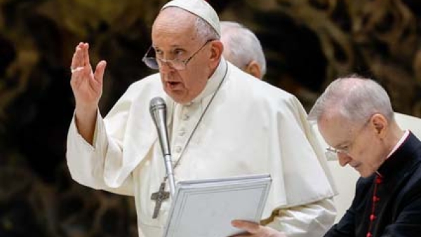 Pope Francis gives his blessing at the end of his weekly general audience in the Paul VI Audience Hall 