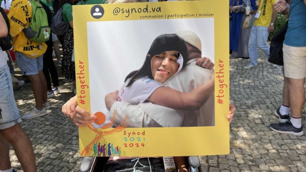 photo "hugging" Pope Francis at the Synod of Bishops' booth