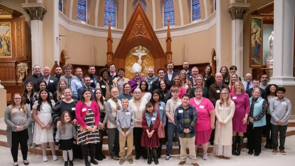 Catechumens and candidates pose for a photo with Bishop Gruss at the Rite of Election and Call to Continuing Conversion in Saginaw on Feb. 18, 2024