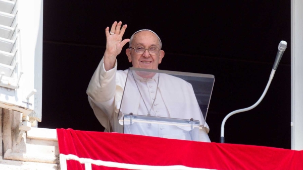 Pope Francis greets visitors gathered in St. Peter's Square