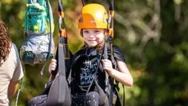 Girl on swing at 5th grade retreat