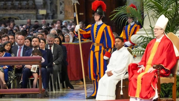 Cardinal Claudio Gugerotti, prefect of the Dicastery for Eastern Churches, presides over the Liturgy of the Lord's Passion in St. Peter's Basilica at the Vatican April 18, 2025. Seated in the front row is U.S. Vice President JD Vance with his family.