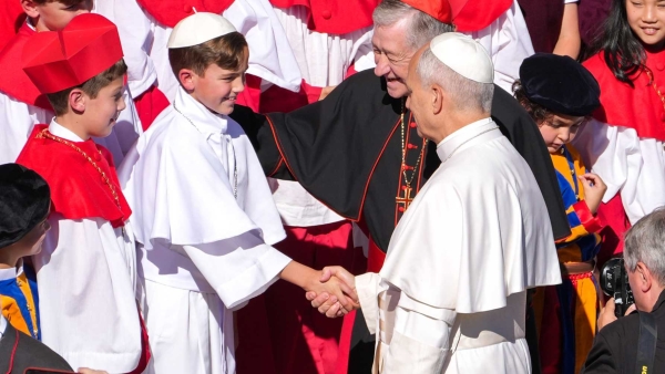 Pope Leo XIV greets fourth grader Augie Wilk, who was elected “Pope Augustine” in a mock conclave May 6 at Our Lady of Mount Carmel Academy in Chicago,