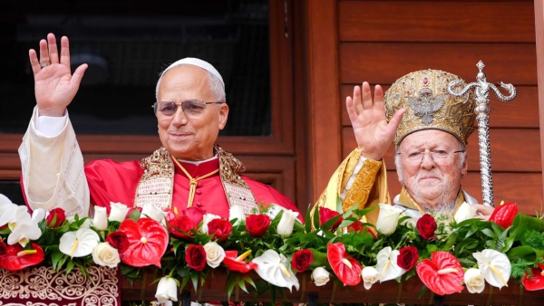 ope Leo XIV and Orthodox Ecumenical Patriarch Bartholomew of Constantinople wave from a balcony