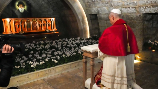 Pope Leo XIV prays in silence before the tomb of St. Charbel