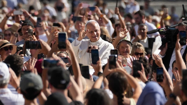 pe Leo XIV greets visitors and pilgrims from the popemobile 