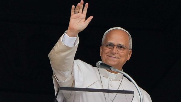 Pope Leo XIV smiles and waves to the faithful